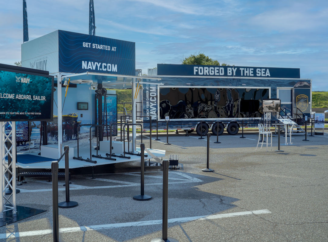 The U.S. Navy’s “Forged by the Sea” mobile exhibit features interactive stations, displays, and a walk-through trailer.