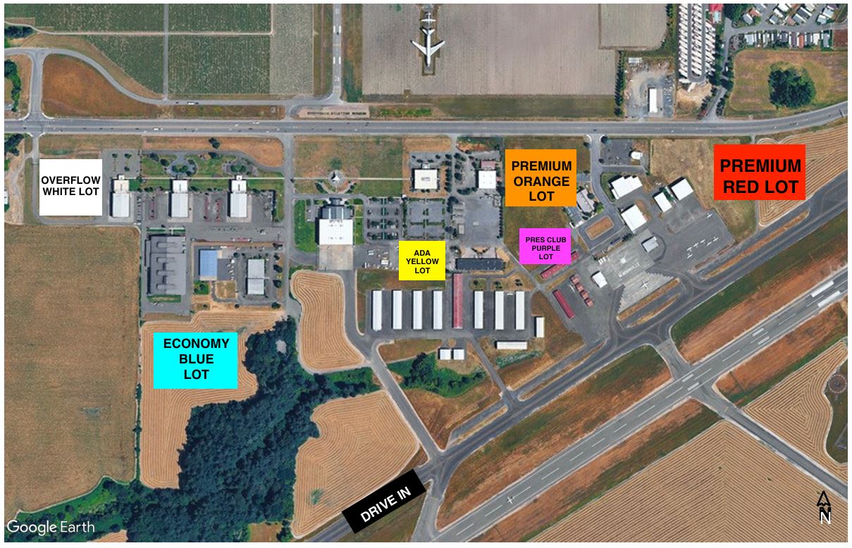 Oregon International Air Show | 2026 McMinnville Parking Map Aerial parking map for the 2026 Oregon International Air Show at McMinnville showing color-coded parking lots around the airport. Economy White Lot is west of the entrance, Standard Blue Lot is southwest, ADA Yellow Lot is near the center, Premium Orange Lot and President's Club Purple Lot are east of the main buildings, and Premium Red Lot is farthest east. A "Drive In" entrance is shown from the south, with roads, airport buildings, and runways providing orientation.